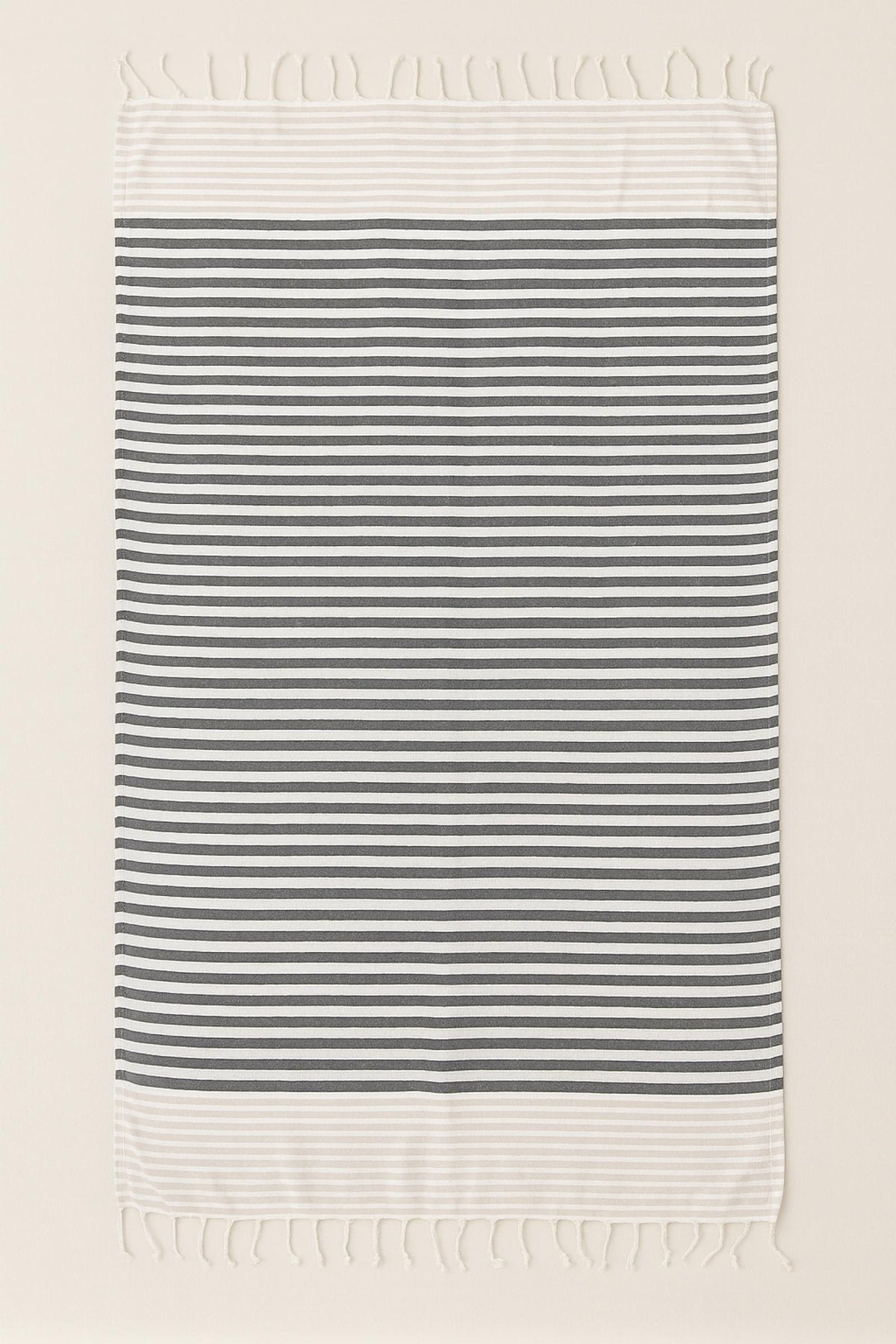 Drap de plage rayé beige et noir